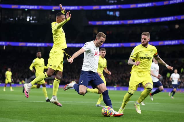 Harry Kane of Tottenham Hotspur is closed down by Rico Henry (Photo by Julian Finney/Getty Images)