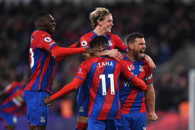  Conor Gallagher celebrates with teammates Christian Benteke and Wilfried Zaha  (Photo by Tom Dulat/Getty Images)