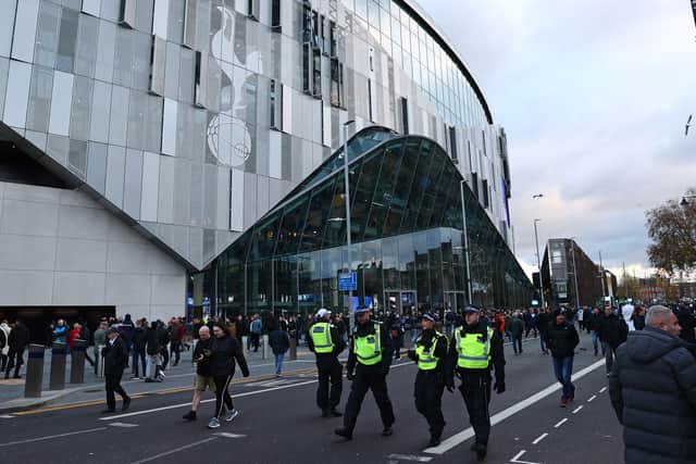 Police officers patrol outside as supporters arrive at the ground ahead of the English Premier League football match (Photo by Adrian DENNIS / AFP) (Photo by ADRIAN DENNIS/AFP via Getty Images)