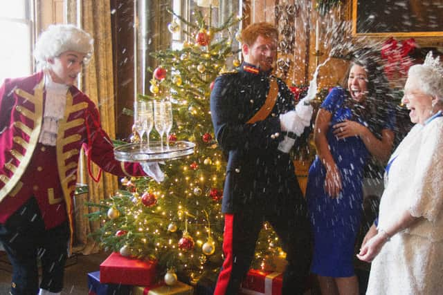 Alison’s faked photo of the Queen, Prince Harry and Meghan Markle spraying champagne. Credit: Alison Jackson