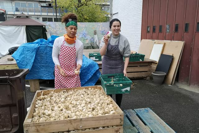 LondonWorld reporter Lynn Rusk, right, volunteering at the Refugee Community Kitchen. Credit: Lynn Rusk