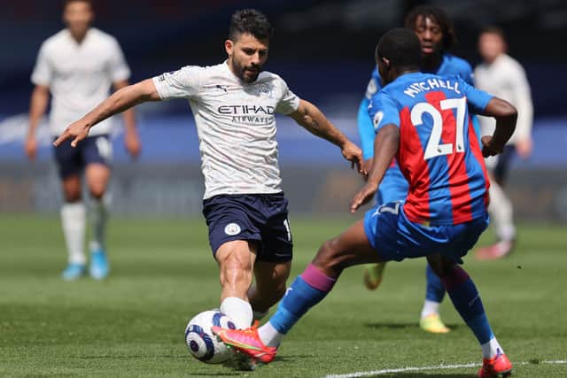 Manchester City's Argentinian striker Sergio Aguero (L) vies with Crystal Palace's English defender Tyrick Mitchell (Photo by CLIVE ROSE/POOL/AFP via Getty Images)