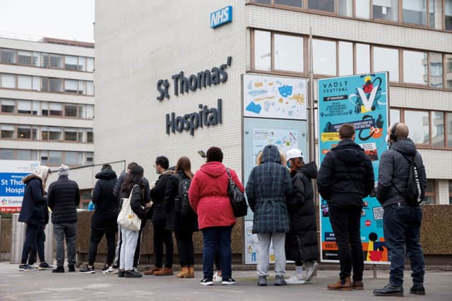 People queue outside a walk-in Covid-19 vaccination centre at St Thomas’s Hospital in Westminster on December 13, 2021 in London, England. Credit: Rob Pinney/Getty Images