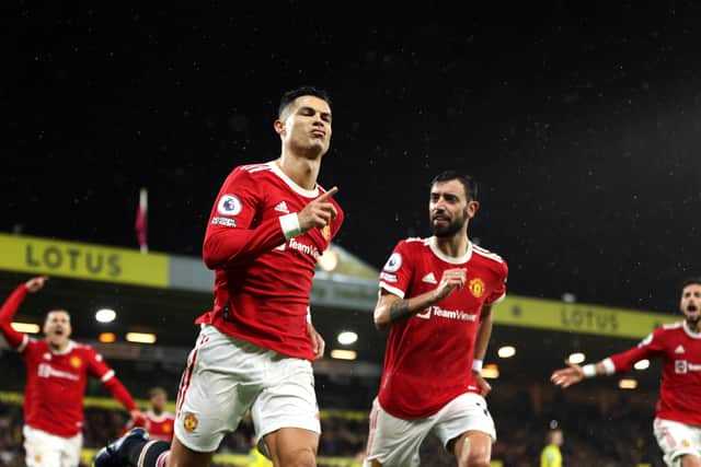  Cristiano Ronaldo of Manchester United celebrates after scoring his sides first goal (Photo by Alex Pantling/Getty Images)