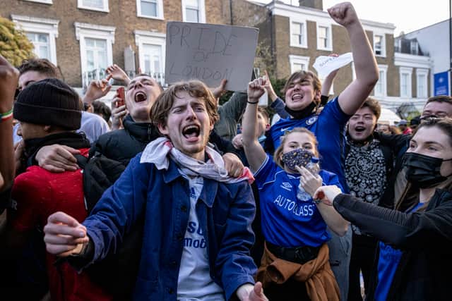 Chelsea Football Club fans celebrate outside the team's Stamford Bridge stadium (Photo by Rob Pinney/Getty Images)