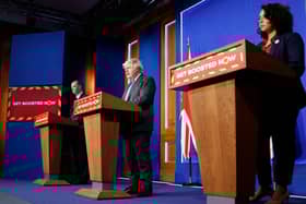 Prime minister Boris Johnson (centre), chief medical officer for England Professor Chris Whitty (left) and director of primary care for NHS England Dr Nikki Kanani (right). Photo by Tolga Akmen - WPA Pool/Getty Images