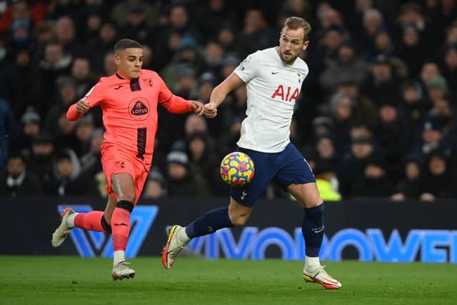 Max Aarons of Norwich City challenges Harry Kane of Tottenham Hotspur (Photo by Mike Hewitt/Getty Images)