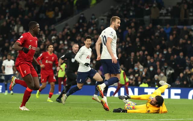 <p>Harry Kane of Tottenham Hotspur has a shot saved by Alisson Becker of Liverpool  (Photo by Julian Finney/Getty Images)</p>
