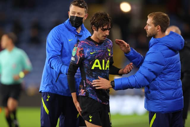 Bryan Gil of Tottenham Hotspur leaves the pitch injured during the Carabao Cup Round of 16 match (Photo by James Gill - Danehouse/Getty Images)