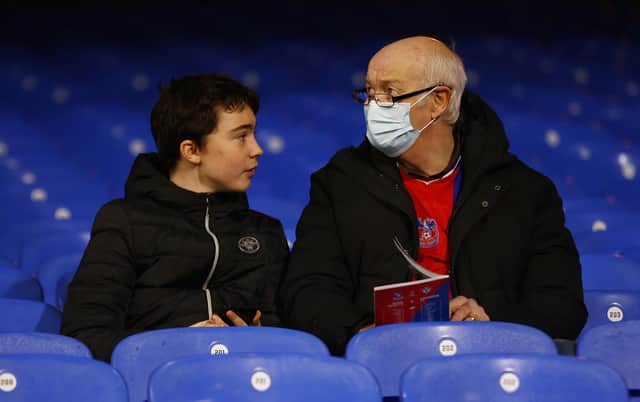 Crystal Palace fans take their seats prior to the Premier League match (Photo by Ben Hoskins/Getty Images)