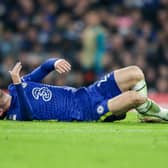 Ben Chilwell of Chelsea goes down injured before he is replaced during the UEFA Champions League (Photo by Robin Jones/Getty Images)