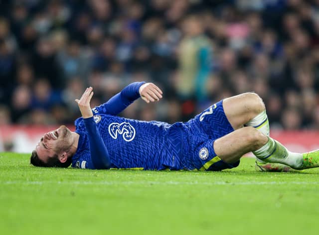 Ben Chilwell of Chelsea goes down injured before he is replaced during the UEFA Champions League (Photo by Robin Jones/Getty Images)