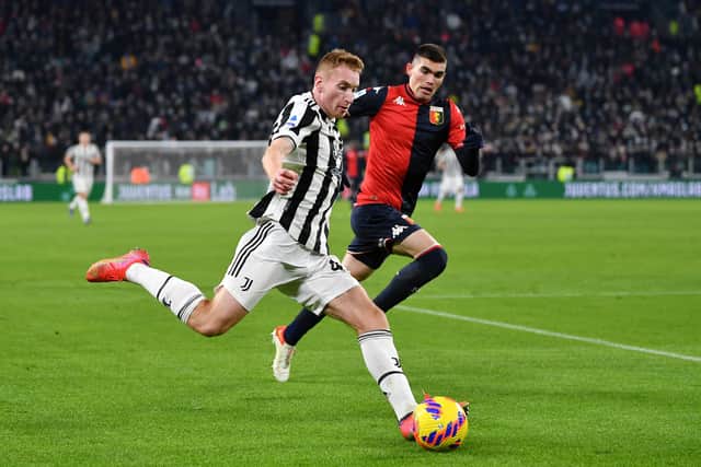 Dejan Kulusevski of Juventus is put under pressure by Johan Vasquez of Genoa  during the Serie A match between Juventus and Genoa CFC at  on December 05, 2021 in Turin, Italy