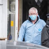Scene of crime investigator at the home where  a man and woman have been found dead after a fire tore through a house in Croydon on Wednesday night. Credit: Tony Kershaw / SWNS