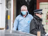 Scene of crime investigator at the home where  a man and woman have been found dead after a fire tore through a house in Croydon on Wednesday night. Credit: Tony Kershaw / SWNS