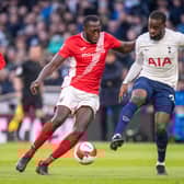 Toumani Diagouraga of Morecambe and Tanguy Ndombele of Tottenham Hotspur (Photo by Sebastian Frej/MB Media/Getty Images)