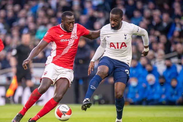 Toumani Diagouraga of Morecambe and Tanguy Ndombele of Tottenham Hotspur (Photo by Sebastian Frej/MB Media/Getty Images)