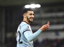 Said Benrahma of West Ham United picks up a lighter that was thrown onto the pitch (Photo by Marc Atkins/Getty Images)