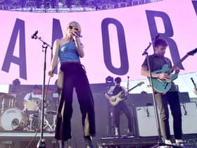 Zac Farro, Hayley Williams, and Josh Farro of Paramore perform onstage in California (Photo: Alberto E. Rodriguez/Getty Images for CBS Radio Inc.)