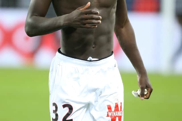 Shirtless Malang Sarr of Nice thanks the supporters following the French Ligue 1 (Photo by Jean Catuffe/Getty Images,)