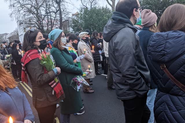 People held candles and stood in silent tribute outside the London Irish Centre in Camden. Credit: Lynn Rusk