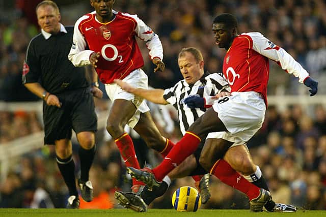 Alan Shearer battles with Kolo Toure and Patrick Vieira at Highbury in 2005. Credit: JIM WATSON/AFP via Getty Images