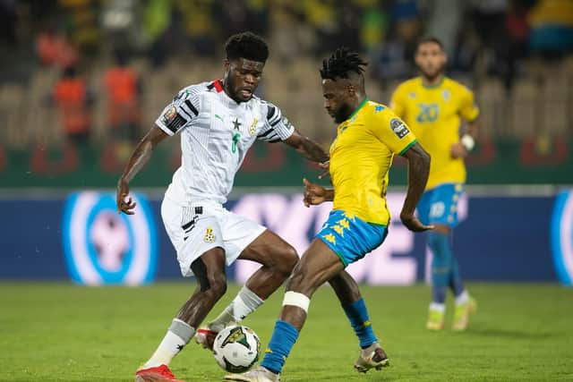 ANDRÃ BIYOGO POKO of Gabon and THOMAS PARTEY of Ghana during the Group C Africa Cup (Photo by Visionhaus/Getty Images)