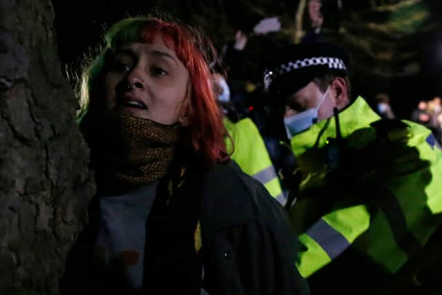 A woman is arrested during a vigil for Sarah Everard. Credit: Hollie Adams/Getty Images