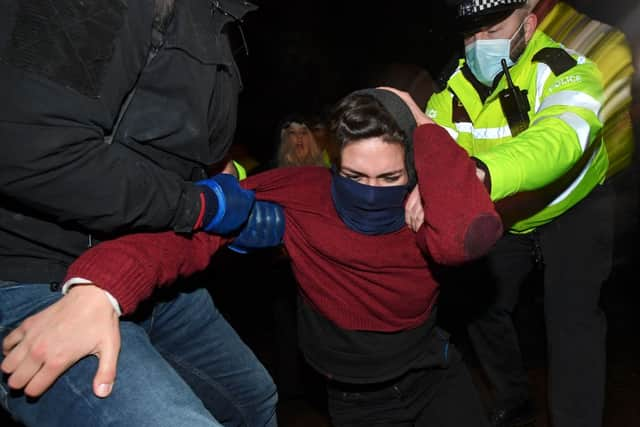 Police officers scuffle with mourners at the Sarah Everard vigil. Credit: JUSTIN TALLIS/AFP via Getty Images