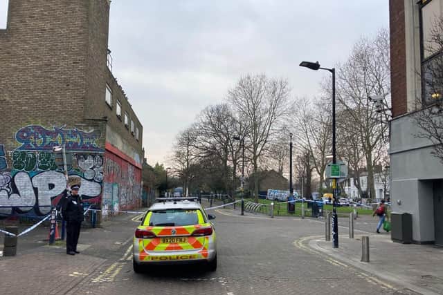 The police cordon in Holly Grove, Peckham, where police originally thought the incident took place.
