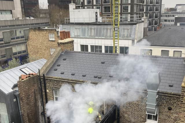 Photos shot by a local resident show the balcony engulfed in flames whilst fire fighters battle the blaze. Credit: SWNS