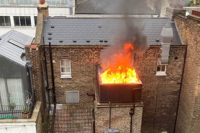  Firefighters were called to Conway Street in Fitzrovia around 11:20am yesterday to deal with the blaze on the balcony at the back of the pub. Credit: SWNS