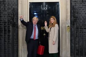 Prime Minister Boris Johnson and his wife Carrie Johnson enter 10 Downing Street.