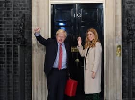 Prime Minister Boris Johnson and his wife Carrie Johnson enter 10 Downing Street.