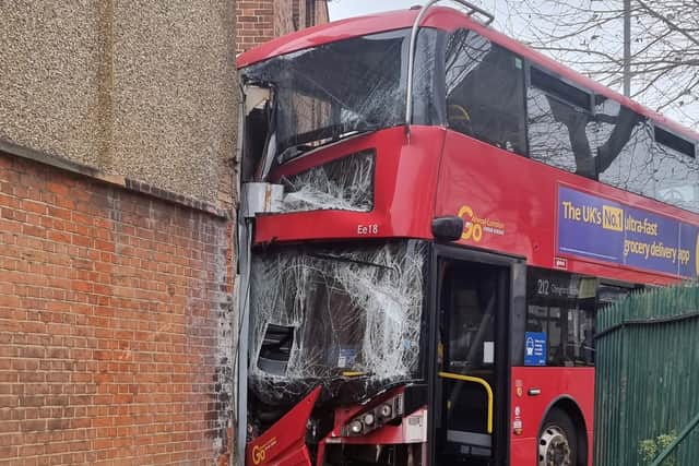 Five people, including three children and two adults, have been taken to hospital after a double-decker bus crashed into a shop in Selwyn Avenue in Highams Park. Credit: SWNS