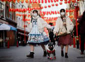Two women celebrating Chinese New Year in Chinatown last year. Credit: TOLGA AKMEN/AFP via Getty Images