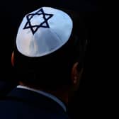 A stock image of a man wearing a kippah - a Jewish skullcap. A teenager denied launching an anti-Semitic attack on two shopkeepers in Stamford Hill, just hours before Holocaust Memorial Day. Credit: RONNY HARTMANN/AFP via Getty Images