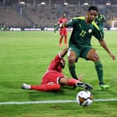 Equatorial Guinea’s forward Emilio Nsue (L) tackles Senegal’s defender Abdou Diallo  during the Africa Cup of Nations. Credit:  CHARLY TRIBALLEAU/AFP via Getty Images