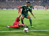 Equatorial Guinea’s forward Emilio Nsue (L) tackles Senegal’s defender Abdou Diallo  during the Africa Cup of Nations. Credit:  CHARLY TRIBALLEAU/AFP via Getty Images