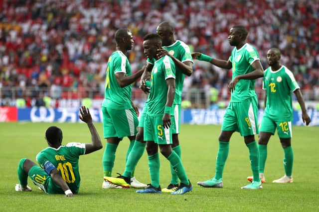 Senegal players celebrates victory following the 2018 FIFA World Cup Russia group H match (Photo by Catherine Ivill/Getty Images)