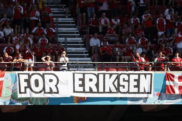 Danish supporters with a banner reading ‘For Eriksen’ pictured during a second game of the group stage at UEFA Euro 2020 championships.  (Photo by BRUNO FAHY/BELGA MAG/AFP via Getty Images)