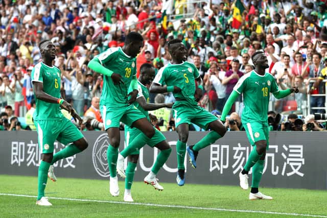 Mbaye Niang of Senegal celebrates with teammates after scoring his team's second (Photo by Catherine Ivill/Getty Images)