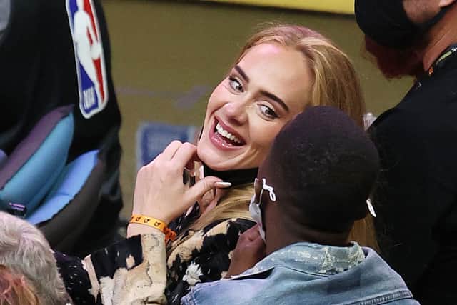 Singer Adele smiles with boyfriend Rich Paul. Credit: Ronald Martinez/Getty Images