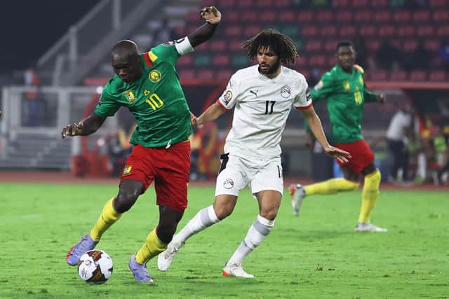 Cameroon’s forward Vincent Aboubakar (L) fights for the ball with Egypt’s midfielder Mohamed Elneny (Photo by DANIEL BELOUMOU OLOMO/AFP via Getty Images)