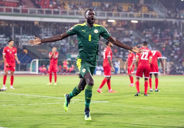 CHEIKHOU KOUYATE celebrates scoring Senegal’s second goal during the Africa Cup (Photo by Visionhaus/Getty Images)