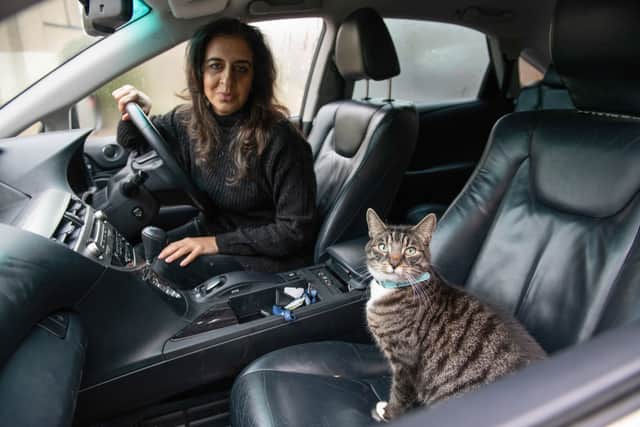 Tahira Sarwar, 47, says her moggy Mika has developed an unusual love for spending time on the road - and won’t let her go out without him. Credit: Tony Kershaw / SWNS