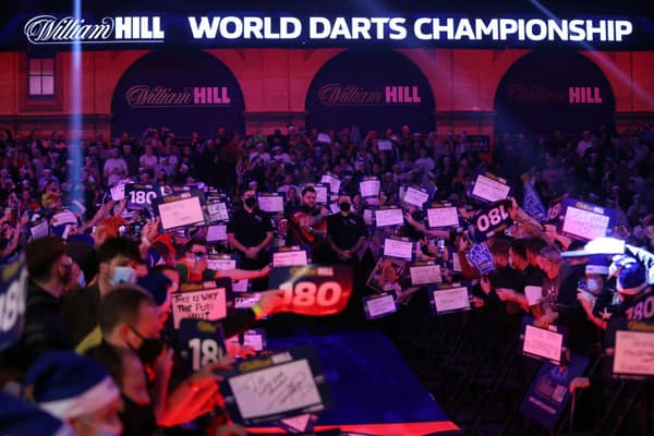 Michael Smith of England in action during the Finals against Peter Wright of Scotland during Day Sixteen of The William Hill World Darts Championship at Alexandra Palace on January 3. Credit: Luke Walker/Getty Images