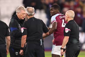 Kurt Zouma of West Ham United looks on as manager David Moyes speaks (Photo by Marc Atkins/Getty Images)