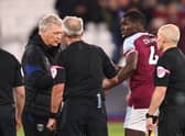 Kurt Zouma of West Ham United looks on as manager David Moyes speaks (Photo by Marc Atkins/Getty Images)
