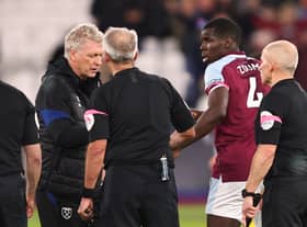 Kurt Zouma of West Ham United looks on as manager David Moyes speaks (Photo by Marc Atkins/Getty Images)